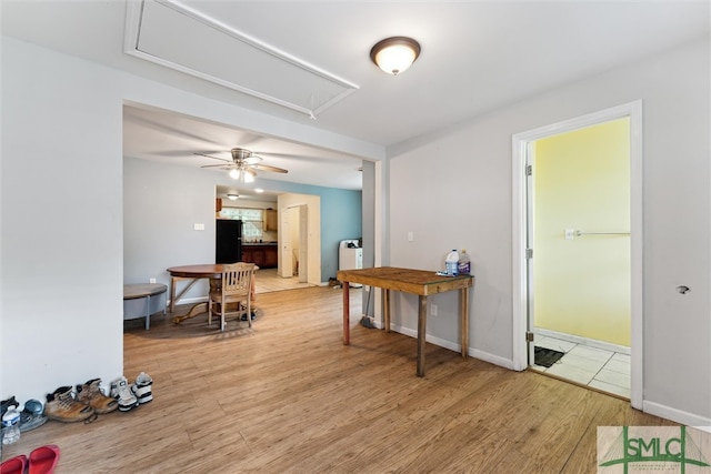 interior space with wood-type flooring and ceiling fan