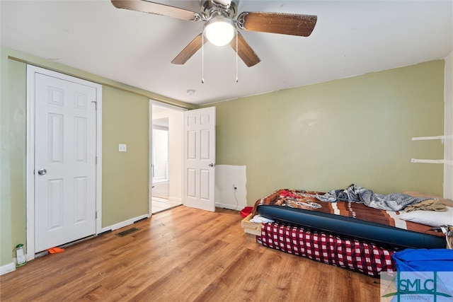 bedroom featuring hardwood / wood-style flooring and ceiling fan