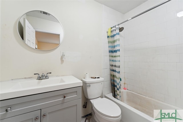 full bathroom with vanity, shower / bath combo with shower curtain, and toilet