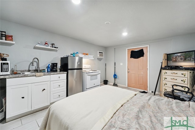 bedroom featuring light tile patterned flooring, stainless steel fridge, and sink