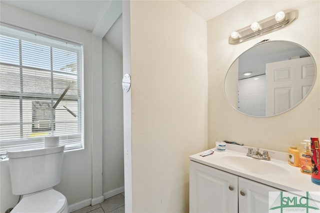 bathroom with tile patterned floors, vanity, and toilet