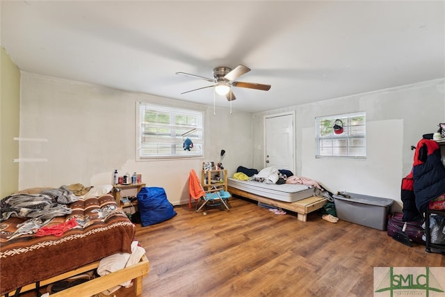 bedroom featuring wood-type flooring and ceiling fan