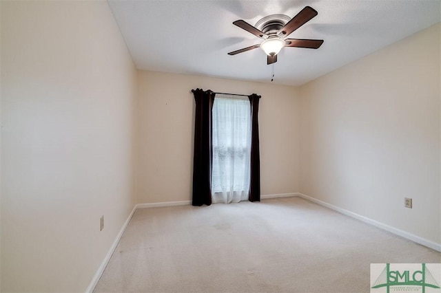 unfurnished room featuring light carpet, a textured ceiling, and ceiling fan