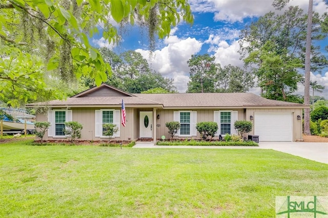 ranch-style house featuring a garage and a front yard