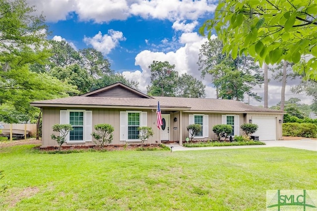 ranch-style home with a garage and a front lawn