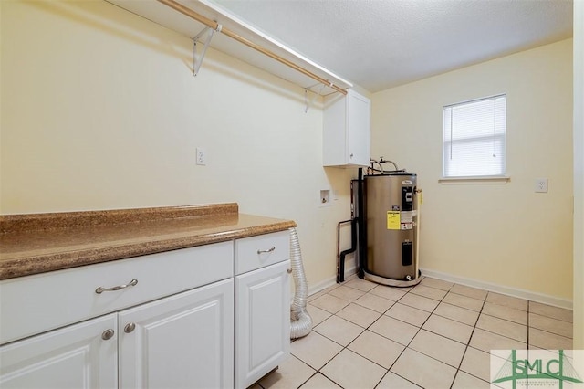 laundry area featuring light tile patterned flooring, cabinets, washer hookup, and electric water heater