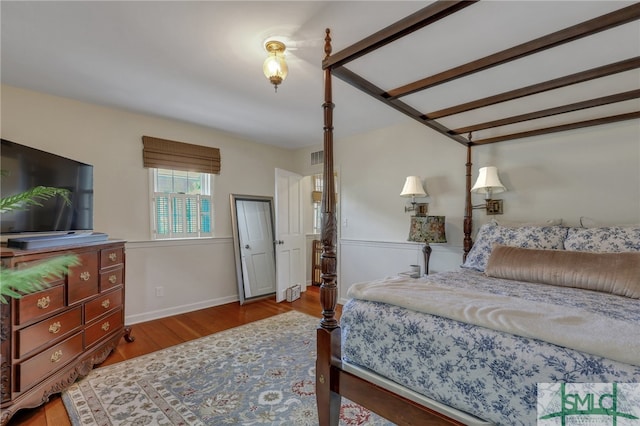 bedroom with hardwood / wood-style floors