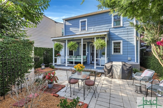 back of house with a patio area