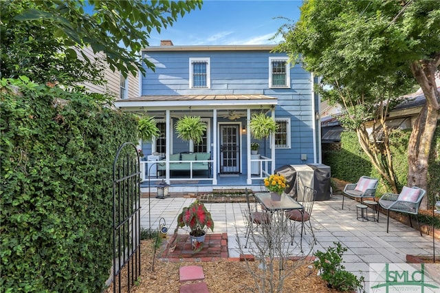 back of property featuring a patio area