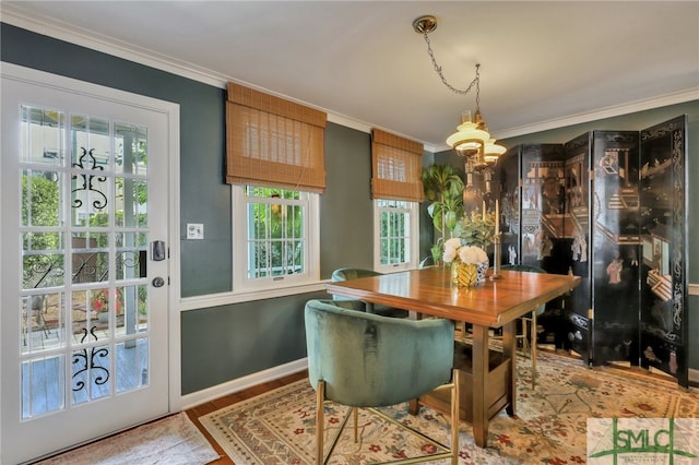 dining room featuring ornamental molding and hardwood / wood-style flooring