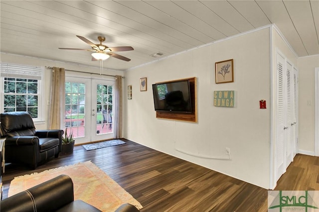 living room with dark hardwood / wood-style flooring, ornamental molding, french doors, and wooden ceiling