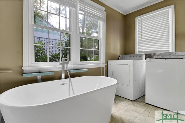 laundry area featuring separate washer and dryer, ornamental molding, and light tile patterned flooring