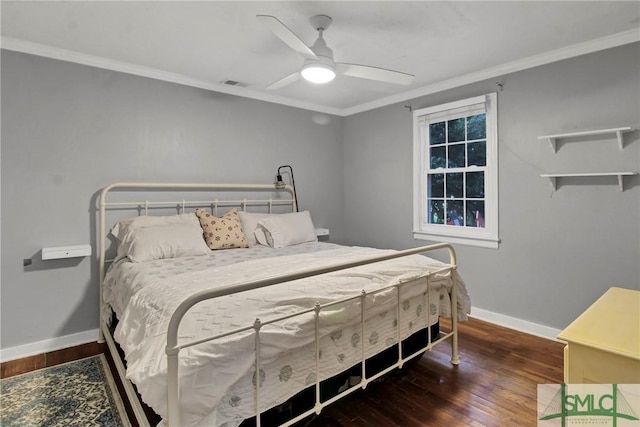 bedroom featuring ceiling fan, crown molding, and dark hardwood / wood-style floors