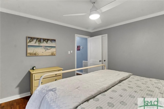 bedroom featuring ceiling fan, dark hardwood / wood-style flooring, and crown molding