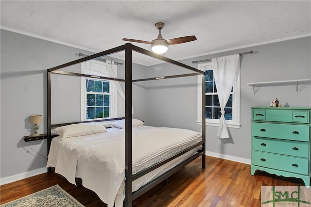 bedroom with ceiling fan and wood-type flooring