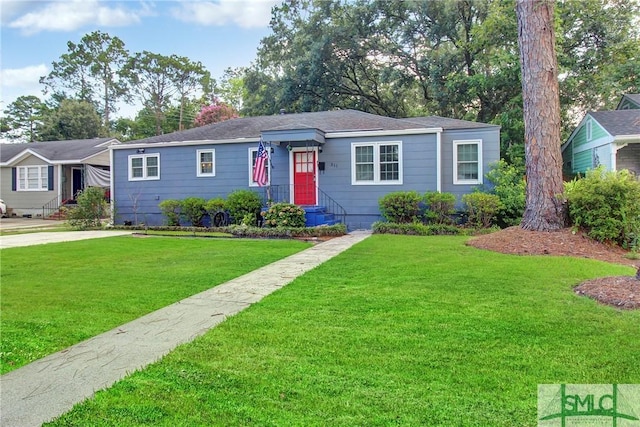 ranch-style home featuring a front yard