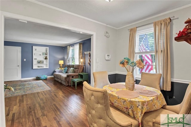 dining room featuring crown molding, a wealth of natural light, built in features, and dark wood-type flooring