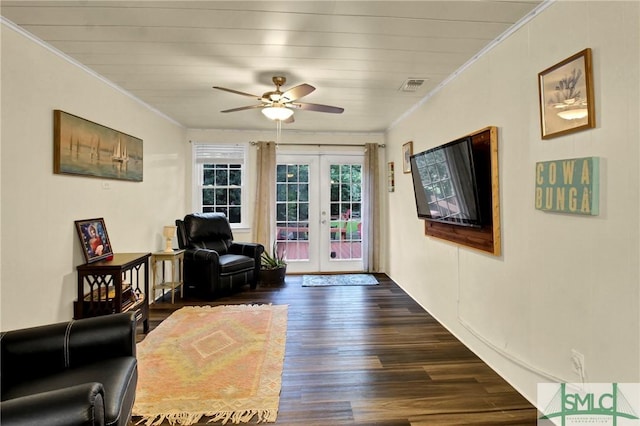 living area with french doors, ceiling fan, ornamental molding, wood ceiling, and dark wood-type flooring