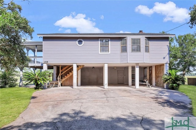 view of front of home featuring a carport