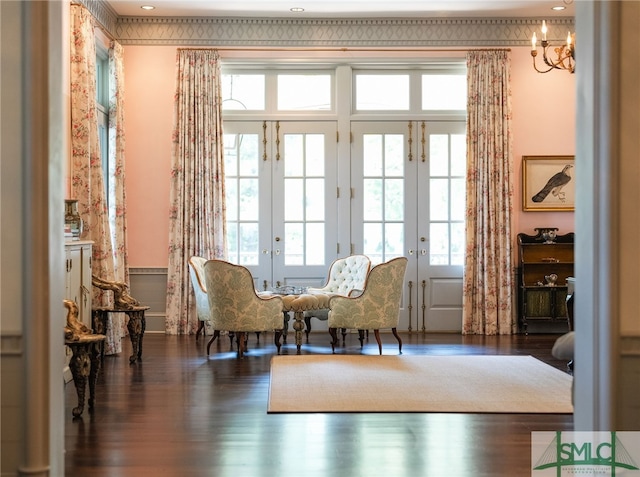 living area with french doors and dark hardwood / wood-style flooring