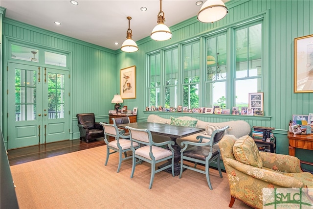 dining room with hardwood / wood-style floors, plenty of natural light, and french doors