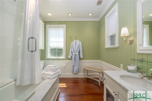 bathroom with hardwood / wood-style flooring, vanity, and crown molding