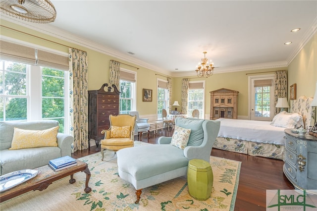 bedroom featuring dark wood-type flooring, crown molding, and an inviting chandelier