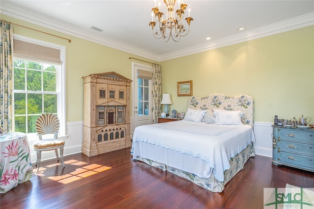 bedroom featuring crown molding, a chandelier, and dark hardwood / wood-style flooring