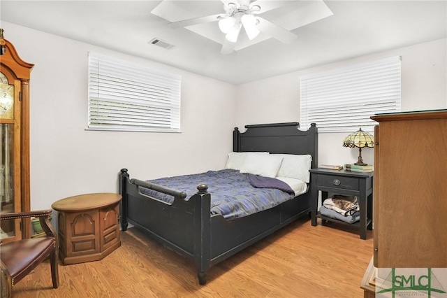 bedroom featuring ceiling fan and light hardwood / wood-style flooring