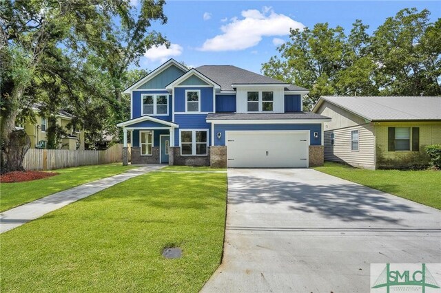 view of front facade featuring a garage and a front lawn