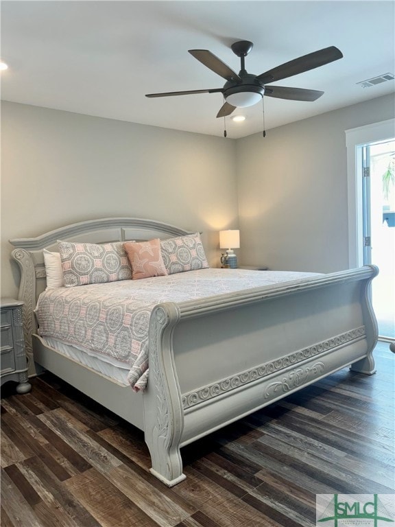 bedroom featuring wood finished floors, ceiling fan, and visible vents