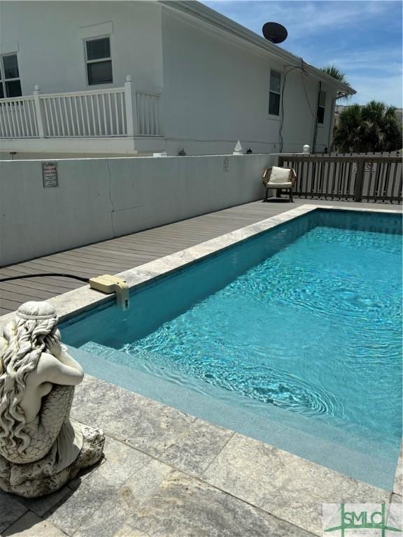 view of pool with fence and a fenced in pool