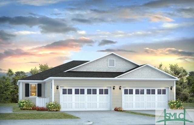 view of front facade featuring an attached garage and concrete driveway