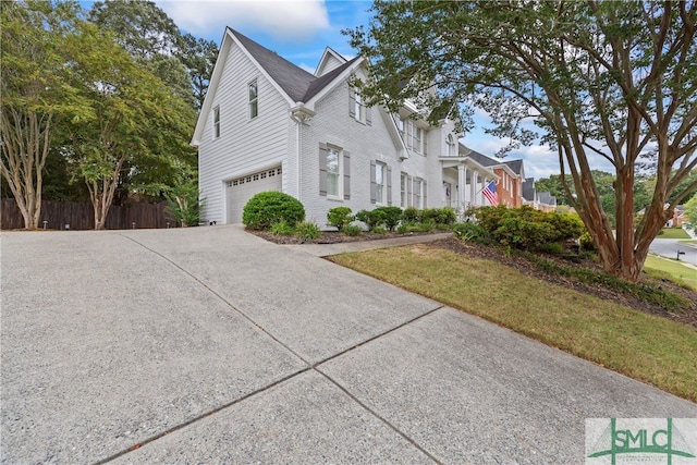 exterior space featuring a garage and a yard