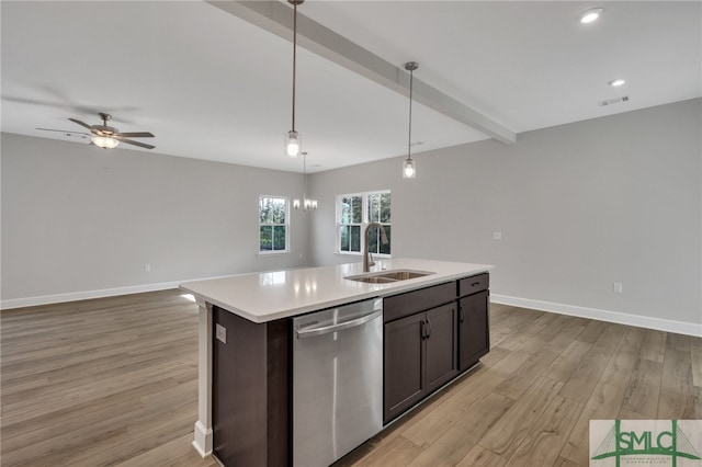 kitchen with sink, stainless steel dishwasher, pendant lighting, light hardwood / wood-style floors, and a center island with sink