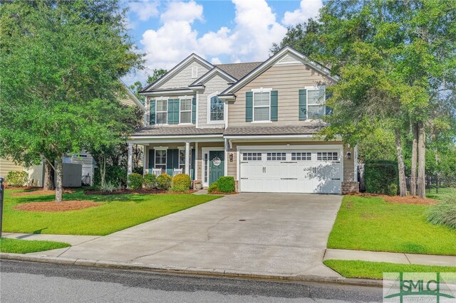 view of front of house with a garage and a front yard