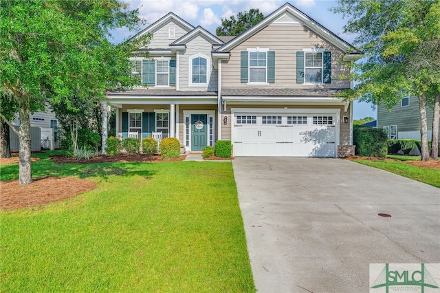 view of front of property with a garage, a porch, and a front yard