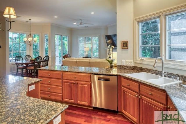 kitchen with dark wood-style flooring, a sink, stainless steel dishwasher, brown cabinetry, and crown molding