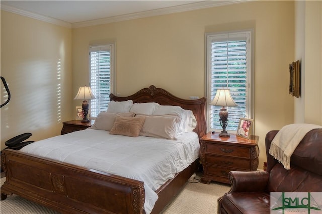 bedroom featuring ornamental molding and carpet flooring