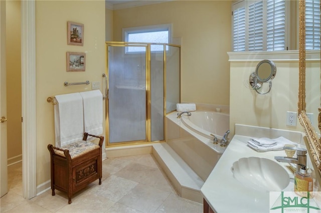 bathroom with a stall shower, baseboards, tile patterned floors, vanity, and a bath