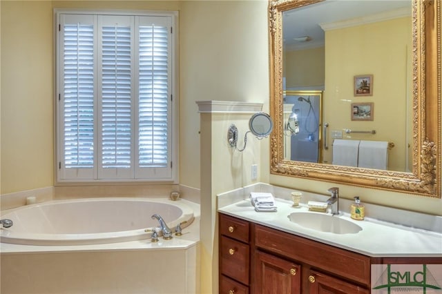 bathroom with a stall shower, a garden tub, crown molding, and vanity