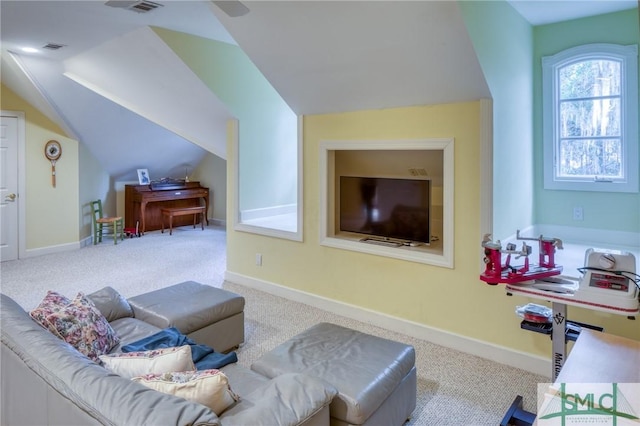 living room featuring carpet, baseboards, and vaulted ceiling