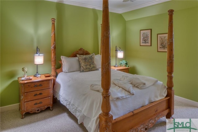 bedroom with carpet floors, baseboards, ornamental molding, and lofted ceiling