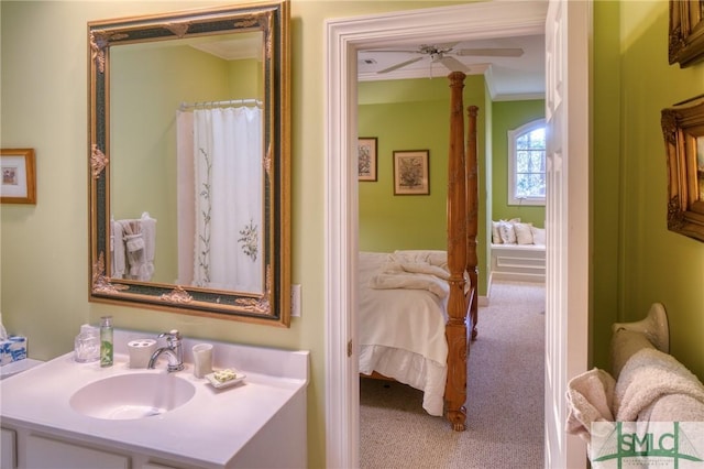 full bath with ensuite bathroom, crown molding, vanity, and a ceiling fan