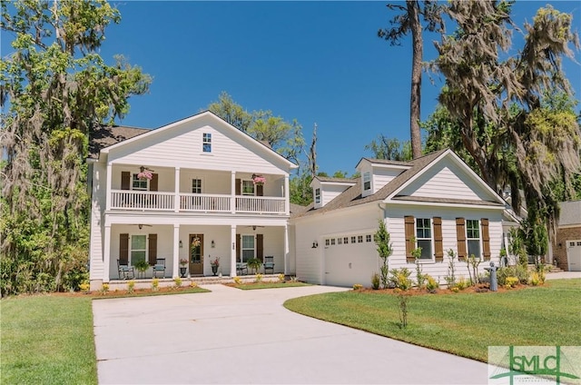 view of front facade with a porch, a balcony, a garage, and a front yard