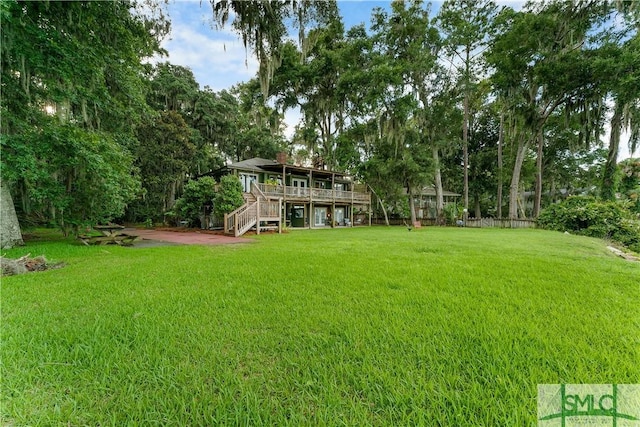 view of yard with a wooden deck