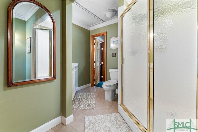 bathroom with crown molding, a shower with door, tile patterned floors, and toilet