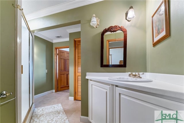 bathroom with vanity, tile patterned flooring, and crown molding