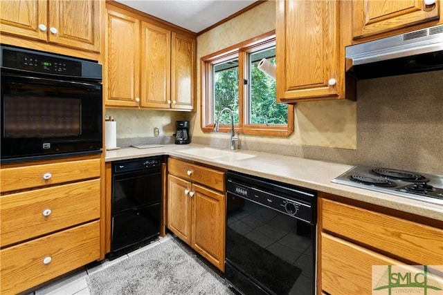 kitchen featuring light tile patterned floors, ornamental molding, sink, and black appliances