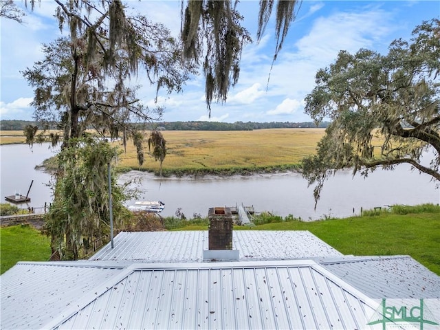 exterior space with a water view and a rural view